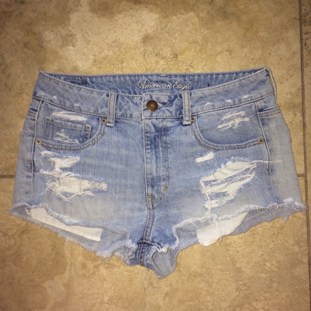 High rise light wash distressed shorts.